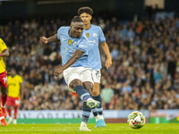 Jeremy Doku #11 of Manchester City F.C. scores a goal during the Carabao Cup Third Round match between Manchester City and Watford at the Et...