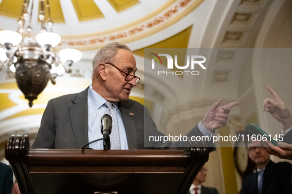 Senate Majority Leader Chuck Schumer (D-NY) and a reporter point at each other when Schumer calls on him for a question during Senate Democr...