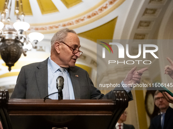 Senate Majority Leader Chuck Schumer (D-NY) and a reporter point at each other when Schumer calls on him for a question during Senate Democr...