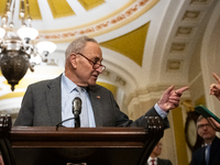 Senate Majority Leader Chuck Schumer (D-NY) and a reporter point at each other when Schumer calls on him for a question during Senate Democr...