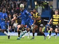 Axel Disasi (2 Chelsea) is challenged by Emile Acquah (20 Barrow) during the Carabao Cup Third Round match between Chelsea and Barrow at Sta...