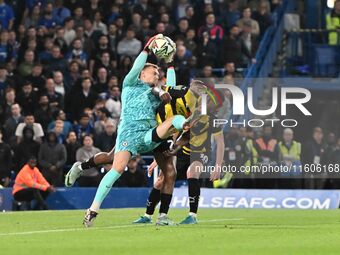 Goalkeeper Filip Jorgensen (12 Chelsea) is challenged by Emile Acquah (20 Barrow) during the Carabao Cup Third Round match between Chelsea a...