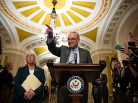 Senate Majority Leader Chuck Schumer (D-NY) calls on a reporter for a question during Senate Democrats' weekly press conference in Washingto...