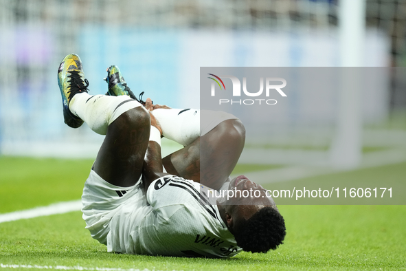 Vinicius Junior left winger of Real Madrid and Brazil lies injured on the pitch during the La Liga match between Real Madrid CF and Deportiv...