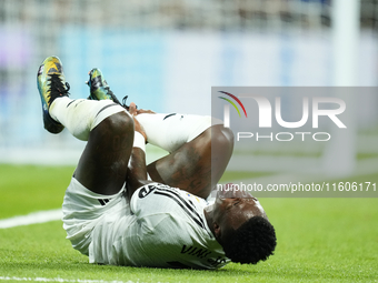 Vinicius Junior left winger of Real Madrid and Brazil lies injured on the pitch during the La Liga match between Real Madrid CF and Deportiv...