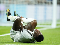 Vinicius Junior left winger of Real Madrid and Brazil lies injured on the pitch during the La Liga match between Real Madrid CF and Deportiv...