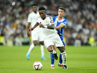 Vinicius Junior left winger of Real Madrid and Brazil and Antonio Blanco defensive midfield of Alaves and Spain compete for the ball during...