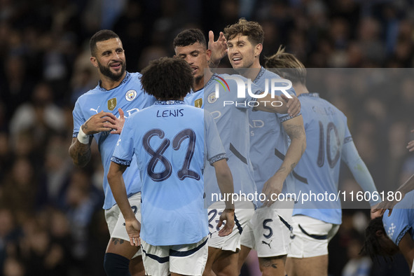 Matheus Nunes #27 of Manchester City F.C. celebrates his goal with teammates during the Carabao Cup Third Round match between Manchester Cit...