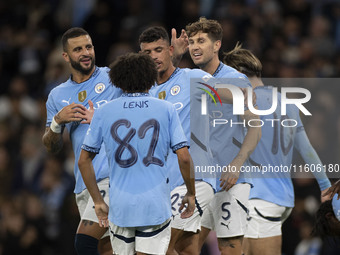 Matheus Nunes #27 of Manchester City F.C. celebrates his goal with teammates during the Carabao Cup Third Round match between Manchester Cit...