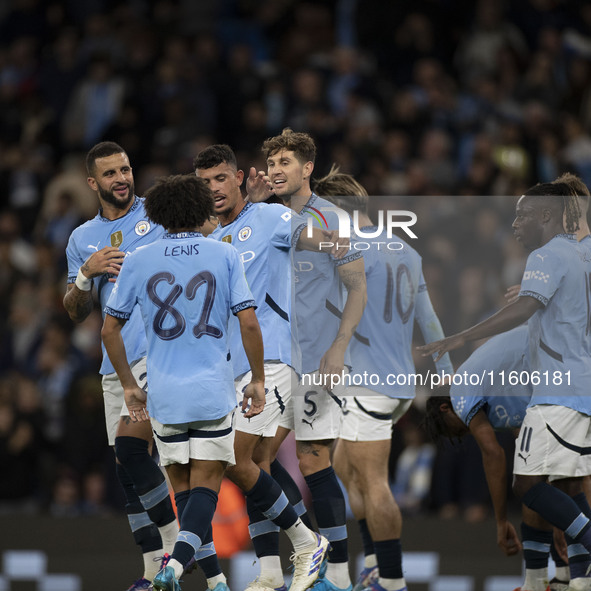 Matheus Nunes #27 of Manchester City F.C. celebrates his goal with teammates during the Carabao Cup Third Round match between Manchester Cit...