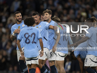 Matheus Nunes #27 of Manchester City F.C. celebrates his goal with teammates during the Carabao Cup Third Round match between Manchester Cit...