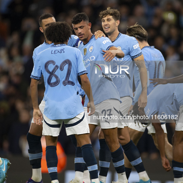 Matheus Nunes #27 of Manchester City F.C. celebrates his goal with teammates during the Carabao Cup Third Round match between Manchester Cit...