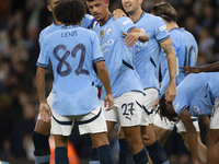 Matheus Nunes #27 of Manchester City F.C. celebrates his goal with teammates during the Carabao Cup Third Round match between Manchester Cit...