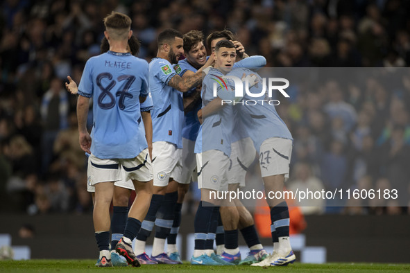 Matheus Nunes #27 of Manchester City F.C. celebrates his goal with teammates during the Carabao Cup Third Round match between Manchester Cit...