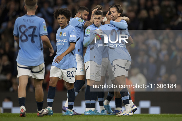 Matheus Nunes #27 of Manchester City F.C. celebrates his goal with teammates during the Carabao Cup Third Round match between Manchester Cit...