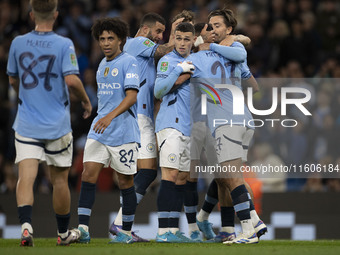 Matheus Nunes #27 of Manchester City F.C. celebrates his goal with teammates during the Carabao Cup Third Round match between Manchester Cit...