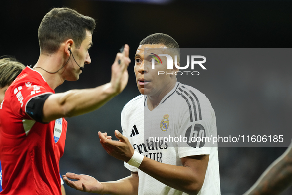 Kylian Mbappe centre-forward of Real Madrid and France protest to referee during the La Liga match between Real Madrid CF and Deportivo Alav...