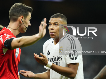 Kylian Mbappe centre-forward of Real Madrid and France protest to referee during the La Liga match between Real Madrid CF and Deportivo Alav...