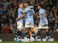 Matheus Nunes #27 of Manchester City F.C. celebrates his goal during the Carabao Cup Third Round match between Manchester City and Watford a...