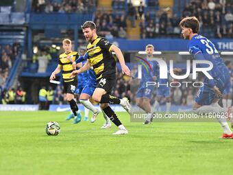 Curtis Stokes (14 Barrow) goes forward during the Carabao Cup Third Round match between Chelsea and Barrow at Stamford Bridge in London, Eng...