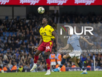 Kwadwo Baah #34 of Watford F.C. heads the ball during the Carabao Cup Third Round match between Manchester City and Watford at the Etihad St...