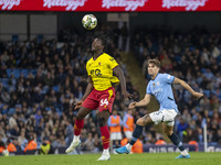 Kwadwo Baah #34 of Watford F.C. heads the ball during the Carabao Cup Third Round match between Manchester City and Watford at the Etihad St...