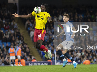 Kwadwo Baah #34 of Watford F.C. chests the ball during the Carabao Cup Third Round match between Manchester City and Watford at the Etihad S...