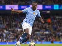 Jeremy Doku #11 of Manchester City F.C. is in action during the Carabao Cup Third Round match between Manchester City and Watford at the Eti...