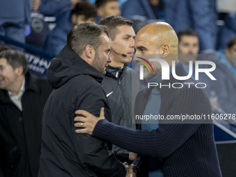 Manchester City F.C. manager Pep Guardiola and Watford F.C. manager Tom Cleverley shake hands during the Carabao Cup Third Round match betwe...