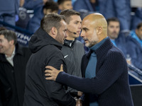 Manchester City F.C. manager Pep Guardiola and Watford F.C. manager Tom Cleverley shake hands during the Carabao Cup Third Round match betwe...