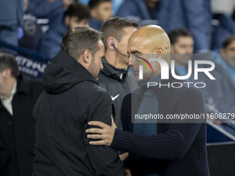 Manchester City F.C. manager Pep Guardiola and Watford F.C. manager Tom Cleverley shake hands during the Carabao Cup Third Round match betwe...