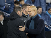 Manchester City F.C. manager Pep Guardiola and Watford F.C. manager Tom Cleverley shake hands during the Carabao Cup Third Round match betwe...