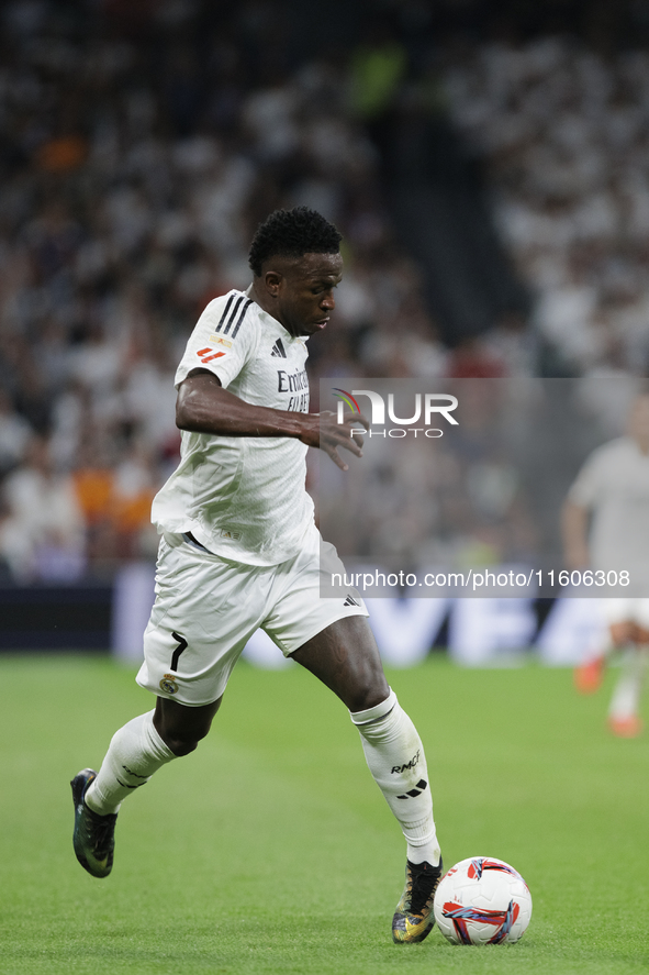 Vinicius Jr of Real Madrid is in action during the La Liga 2024/25 match between Real Madrid and Alaves at Santiago Bernabeu Stadium in Madr...