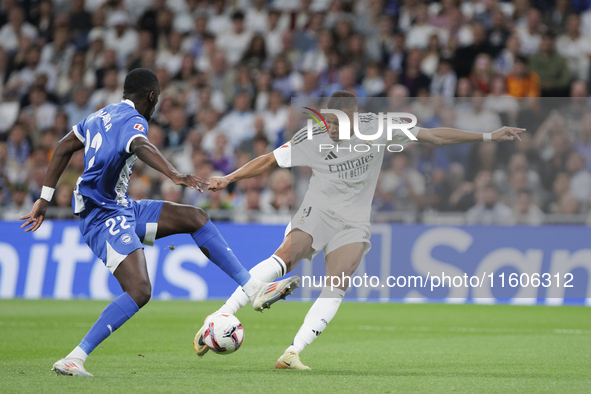 Kylian Mbappe of Real Madrid attempts a shot during the La Liga 2024/25 match between Real Madrid and Alaves at Santiago Bernabeu Stadium in...