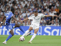 Kylian Mbappe of Real Madrid attempts a shot during the La Liga 2024/25 match between Real Madrid and Alaves at Santiago Bernabeu Stadium in...