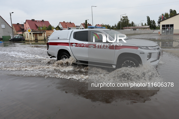 Fire fighter car is seen at flooded street in Lewin Brzeski, Poland on September 23, 2024. 