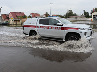 Fire fighter car is seen at flooded street in Lewin Brzeski, Poland on September 23, 2024. (