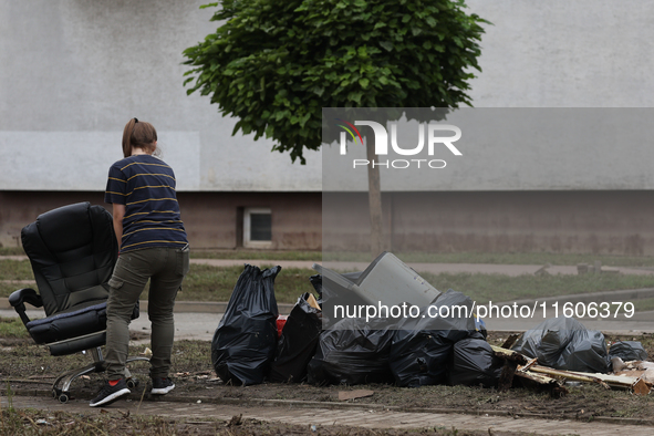 A person cleans up after flooding in Lewin Brzeski, Poland on September 23, 2024. 