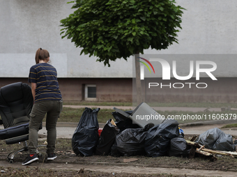 A person cleans up after flooding in Lewin Brzeski, Poland on September 23, 2024. (