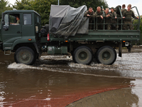 Army vehicle is seen at the flooded street in Lewin Brzeski, Poland on September 23, 2024. (