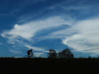 A Cyclist rides the flood embankment in Krakow, Poland on September 23, 2024. (