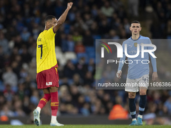 Tom Ince #7 of Watford F.C. celebrates his goal during the Carabao Cup Third Round match between Manchester City and Watford at the Etihad S...