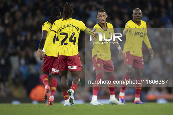 Tom Ince #7 of Watford F.C. celebrates his goal with teammates during the Carabao Cup Third Round match between Manchester City and Watford...