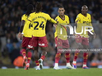 Tom Ince #7 of Watford F.C. celebrates his goal with teammates during the Carabao Cup Third Round match between Manchester City and Watford...