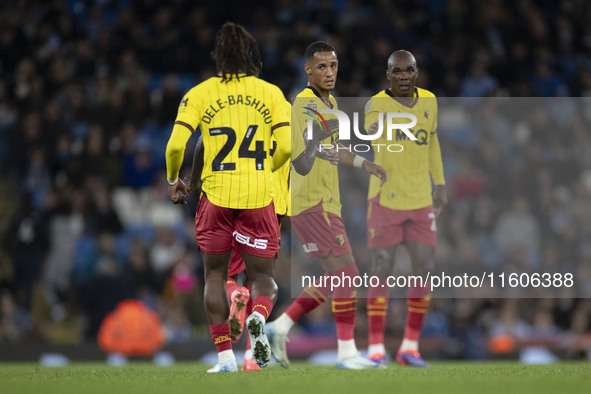 Tom Ince #7 of Watford F.C. celebrates his goal with teammates during the Carabao Cup Third Round match between Manchester City and Watford...