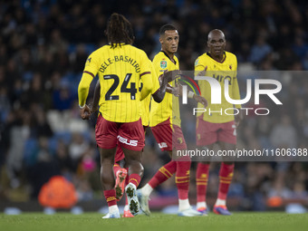 Tom Ince #7 of Watford F.C. celebrates his goal with teammates during the Carabao Cup Third Round match between Manchester City and Watford...