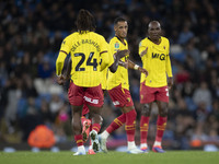 Tom Ince #7 of Watford F.C. celebrates his goal with teammates during the Carabao Cup Third Round match between Manchester City and Watford...