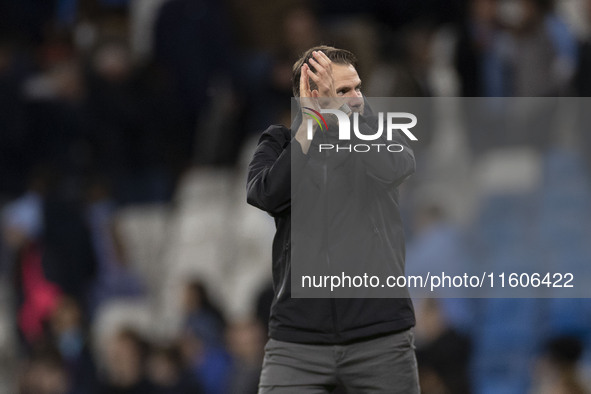 Watford F.C. manager Tom Cleverley applauds at full time during the Carabao Cup Third Round match between Manchester City and Watford at the...