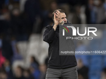 Watford F.C. manager Tom Cleverley applauds at full time during the Carabao Cup Third Round match between Manchester City and Watford at the...