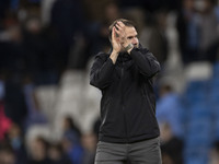 Watford F.C. manager Tom Cleverley applauds at full time during the Carabao Cup Third Round match between Manchester City and Watford at the...